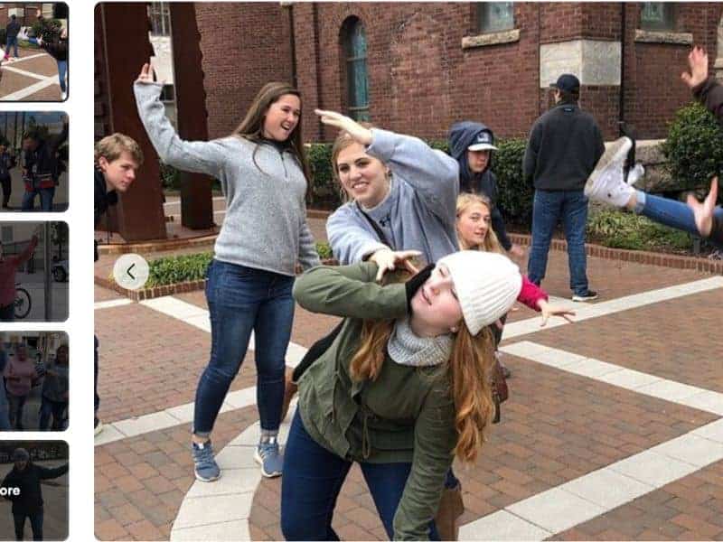 A group of people in wacky poses during a scavenger hunt in Portland, Maine.